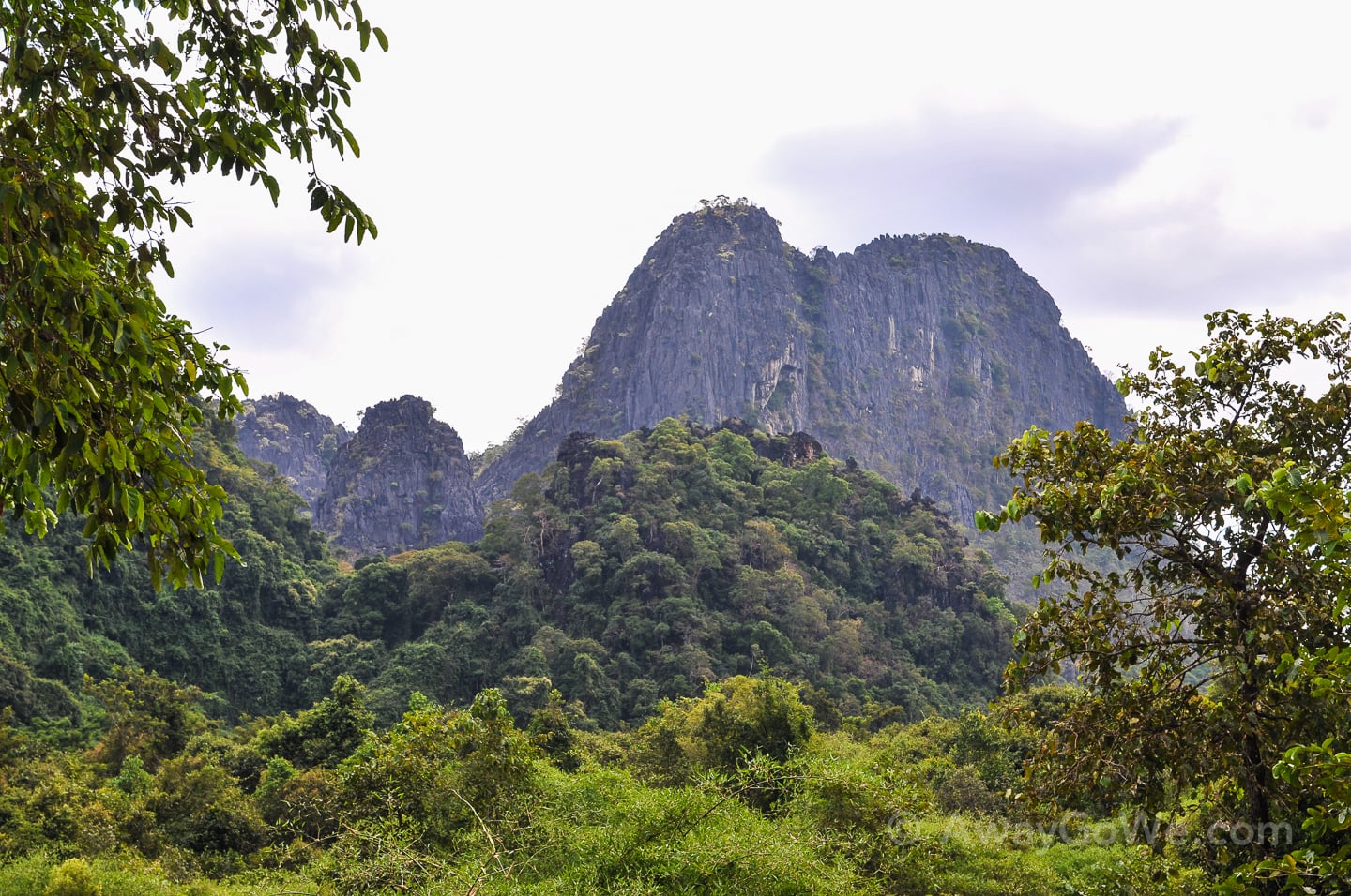 karst peeks surrounded by jungle near buddha cave in laos