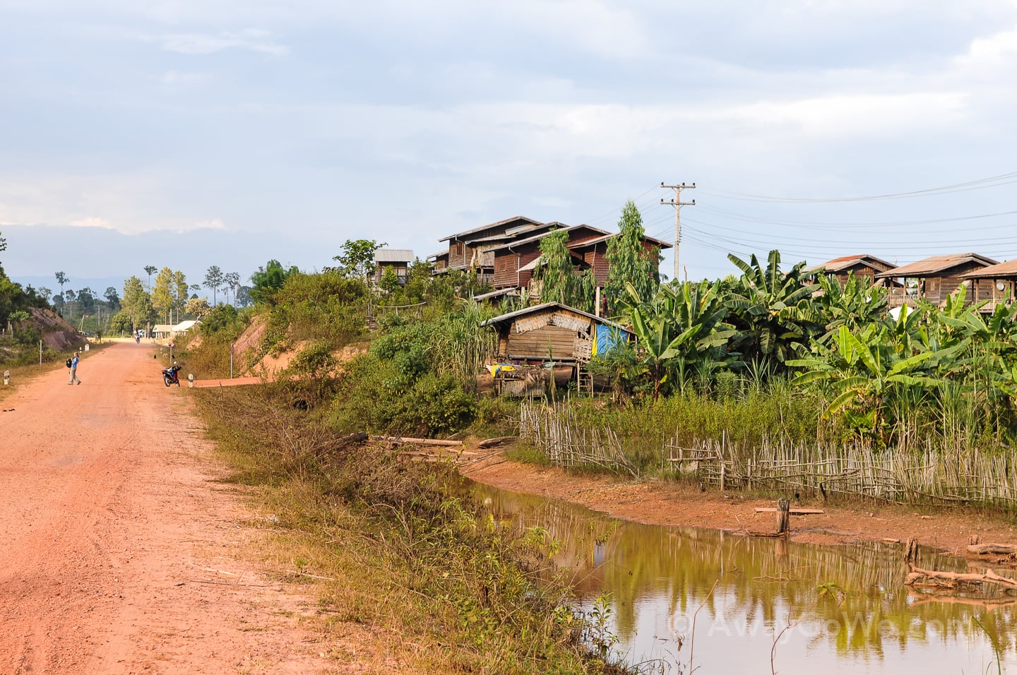 dirt road into a small village in laos
